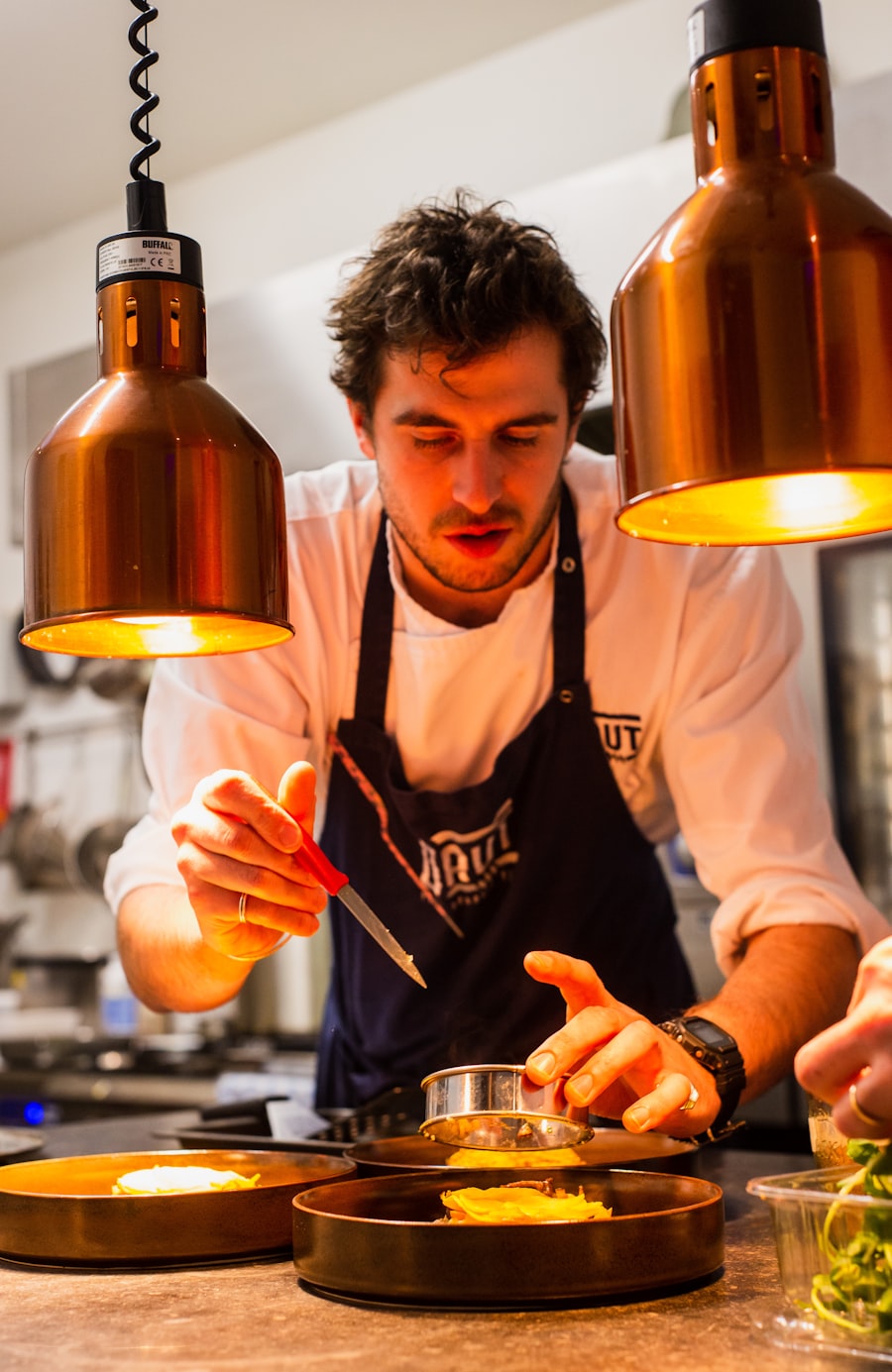 Chef plating a course