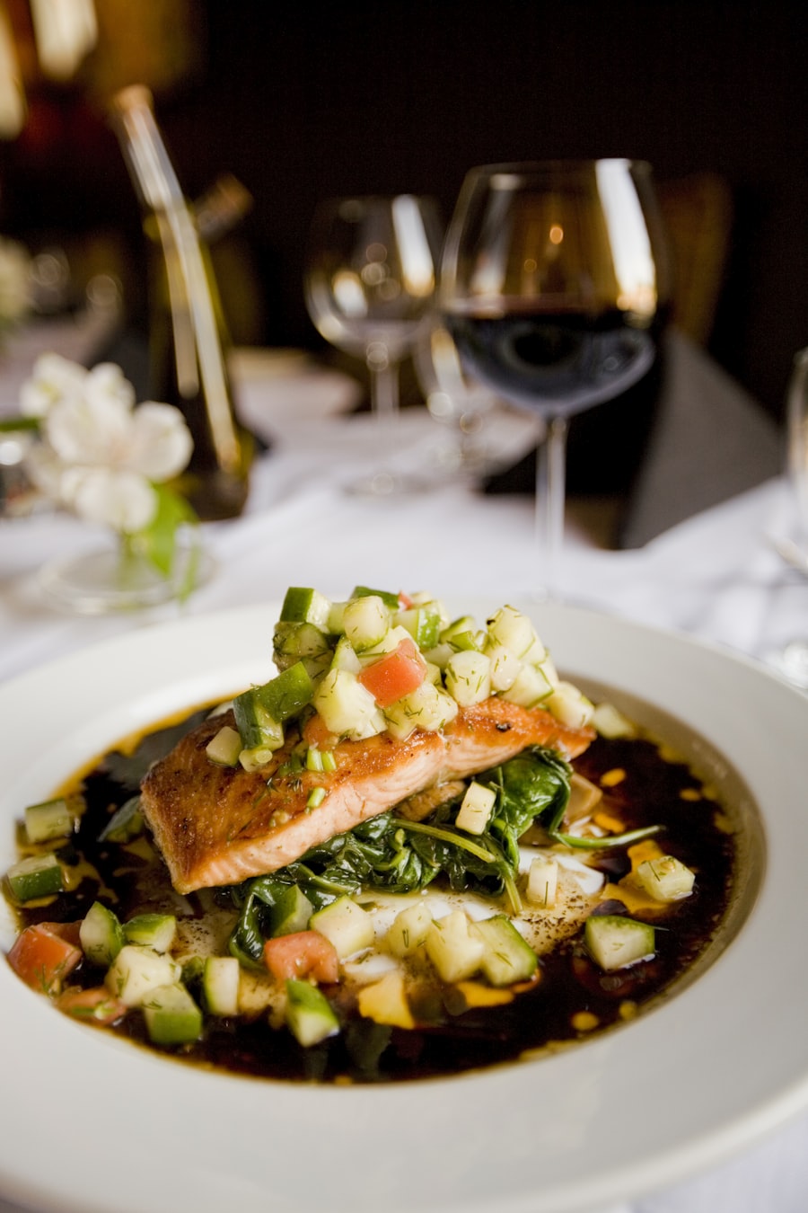 A plated spring dinner with wine